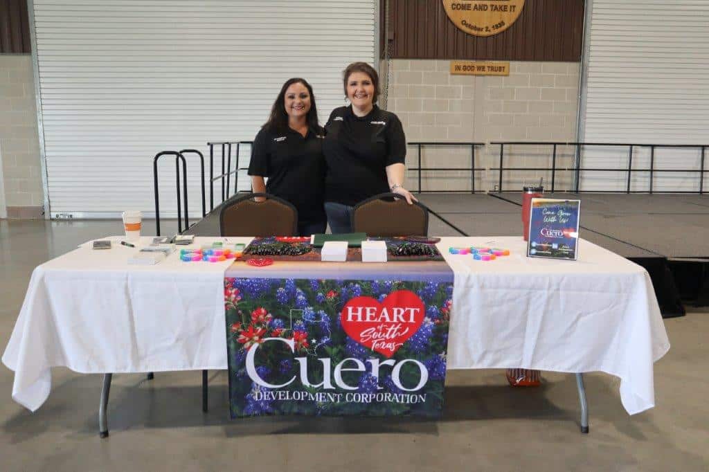 Two women at a Cuero Development Corporation booth